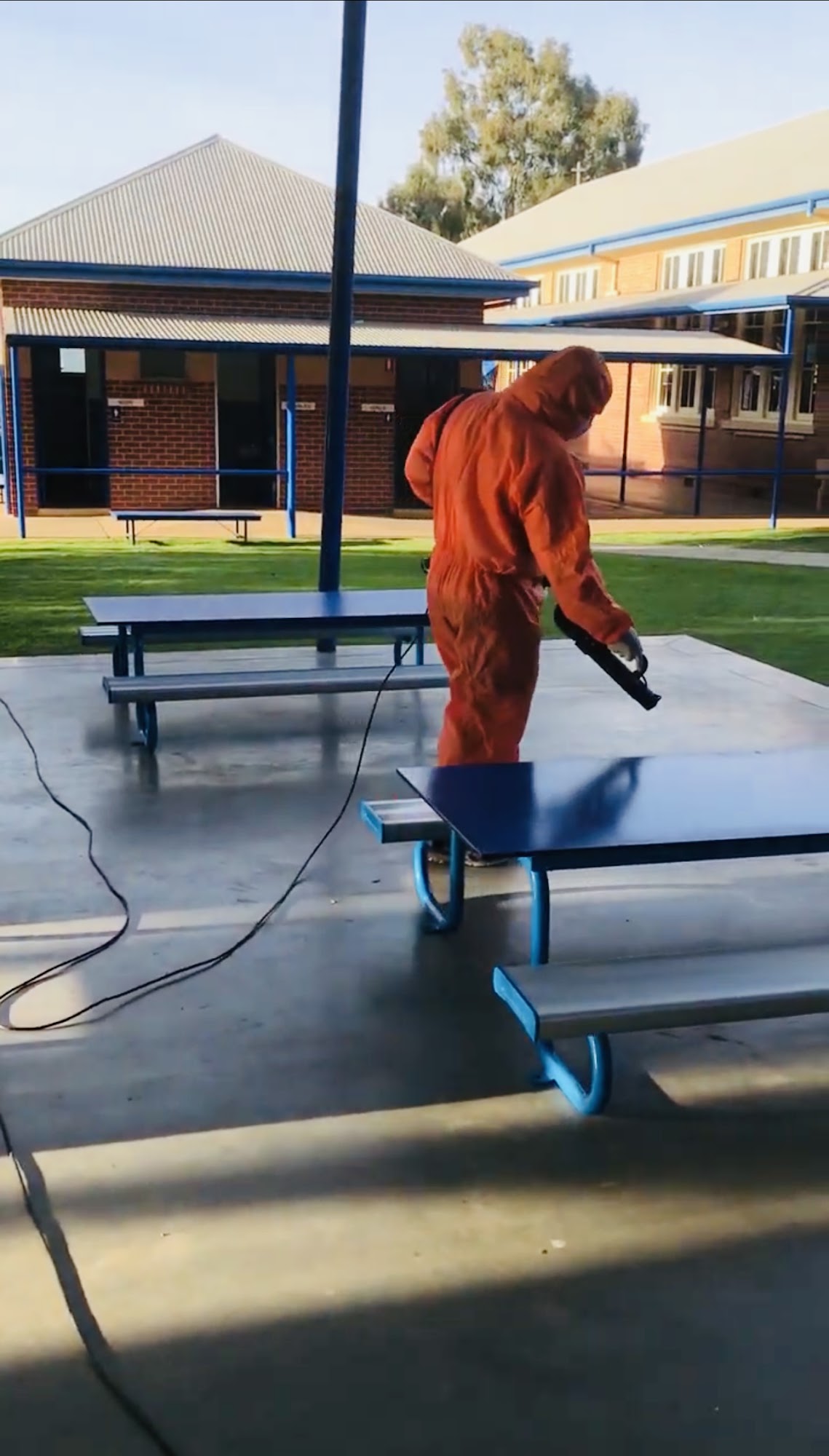 Cleaning outdoor furniture at a local Mildura school