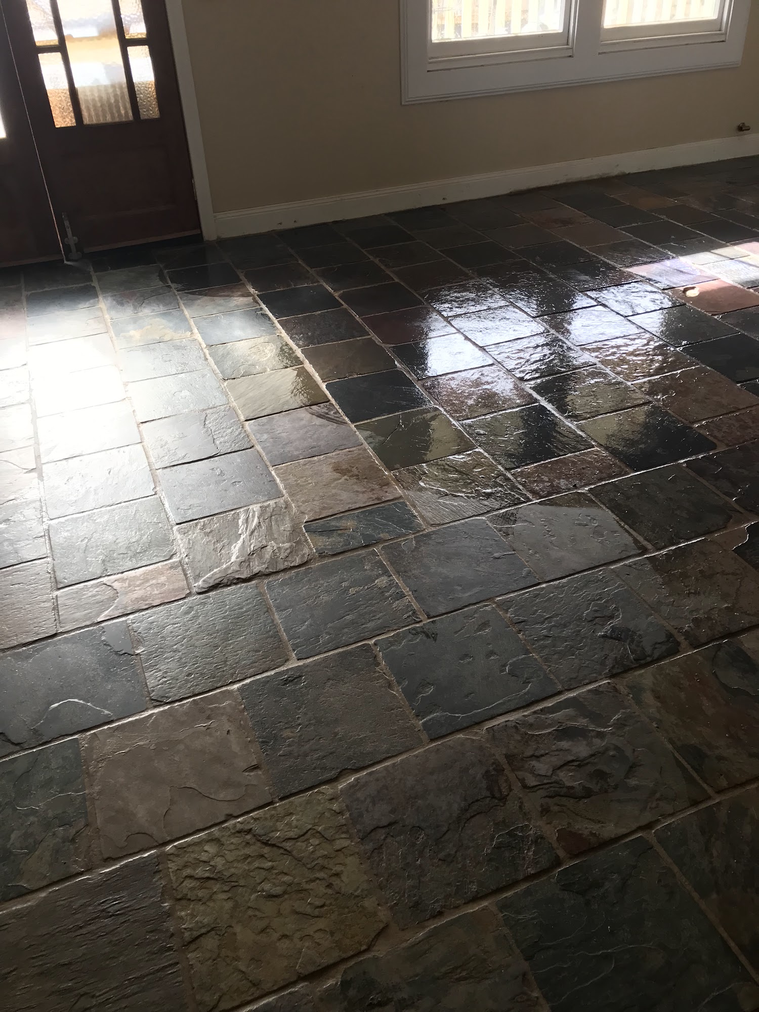 Restored slate tile floor gleaming after a professional clean